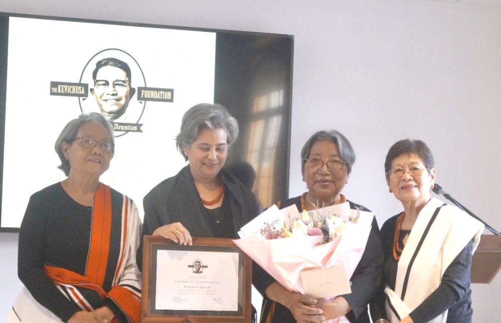 The recipient of A Kevichusa Citizenship Award 2022 Neidonuo Angami (2nd from Right), along with Dr Joyce Zinyü Angami and others during the ceremony on December 10. (Morung Photo)